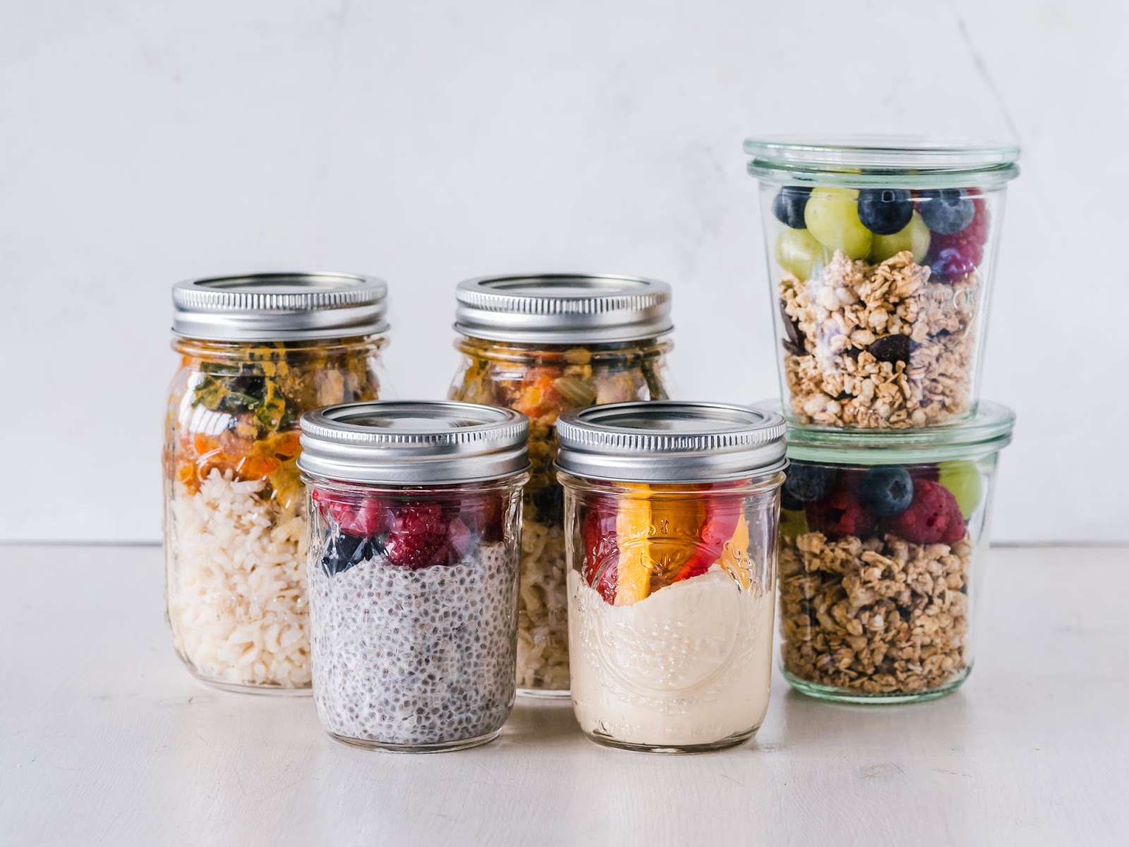 healthy fruits and granola snacks in jars 