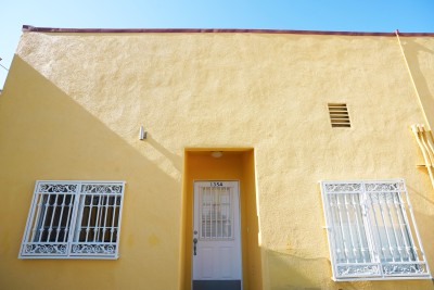 exterior of yellow apartment building 