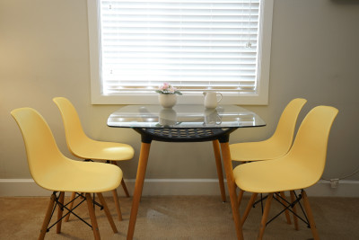 yellow chair with clean and bright dining table