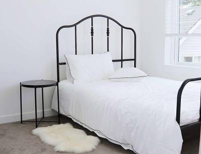 white bed with rail frame 