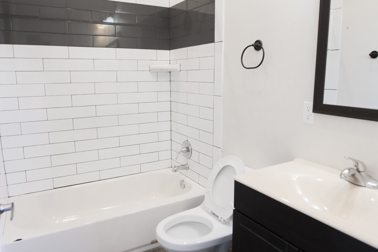 white bathroom with White and Grey tile