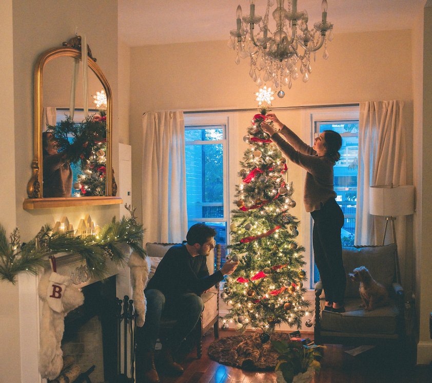 man and woman decorating a Christmas tree in Tripalink Property 