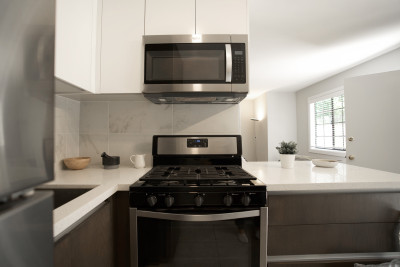 modern kitchen furnished with microwaves and oven