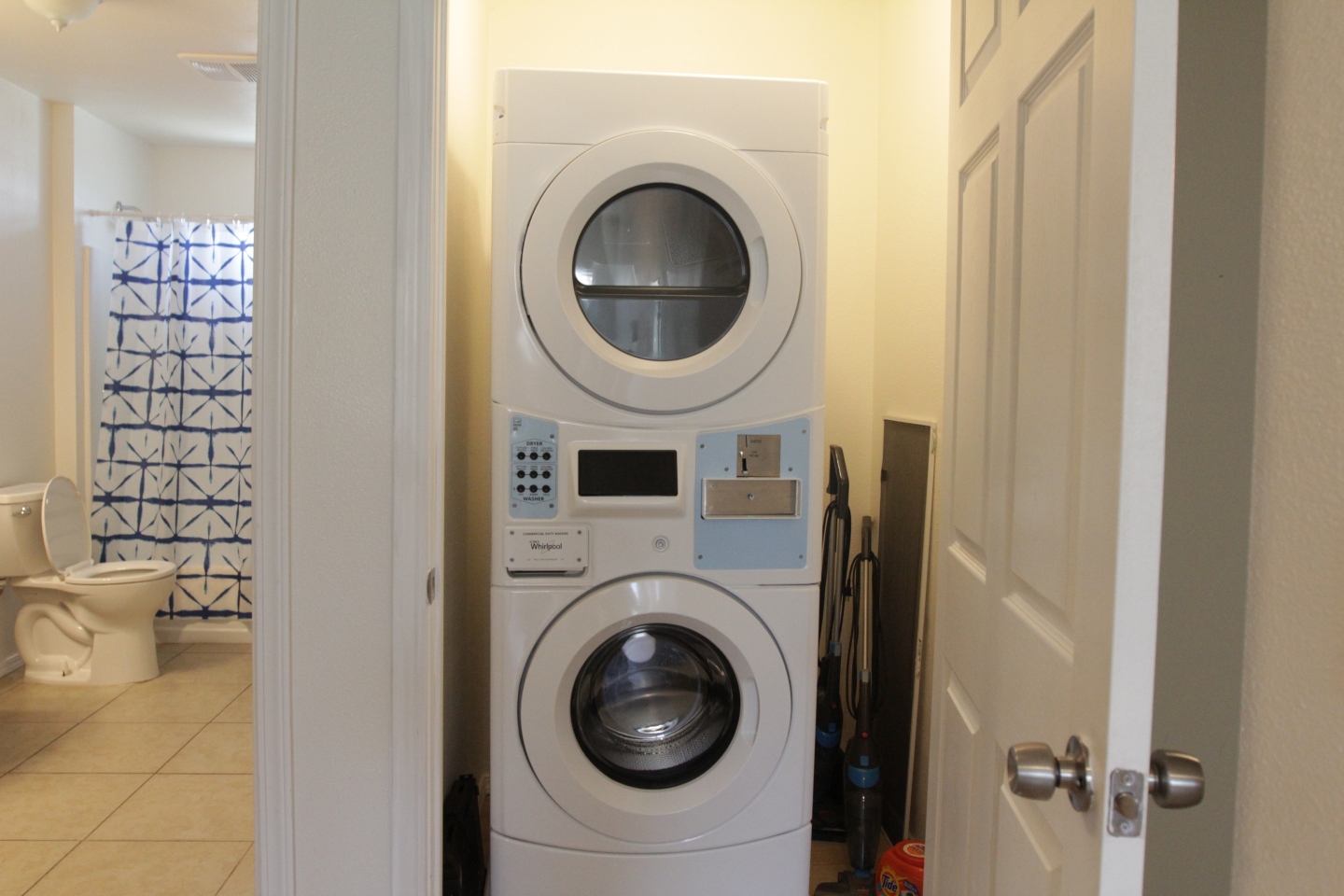 white washer and dryer stacked 
