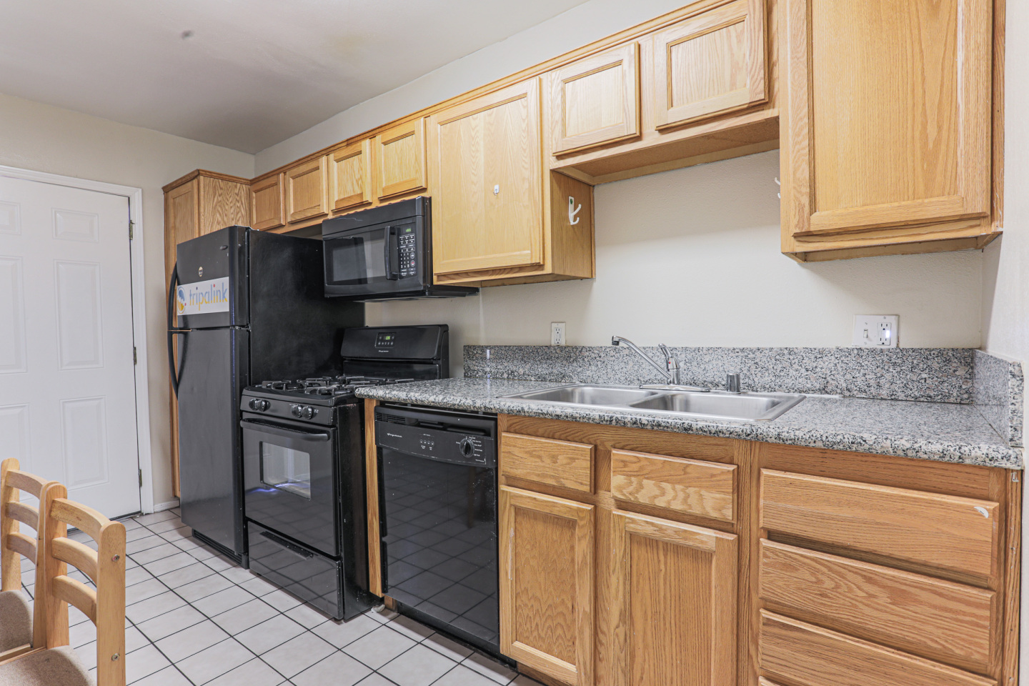 Tripalink Property, Kitchen, black appliances, USC student housing, Bright color