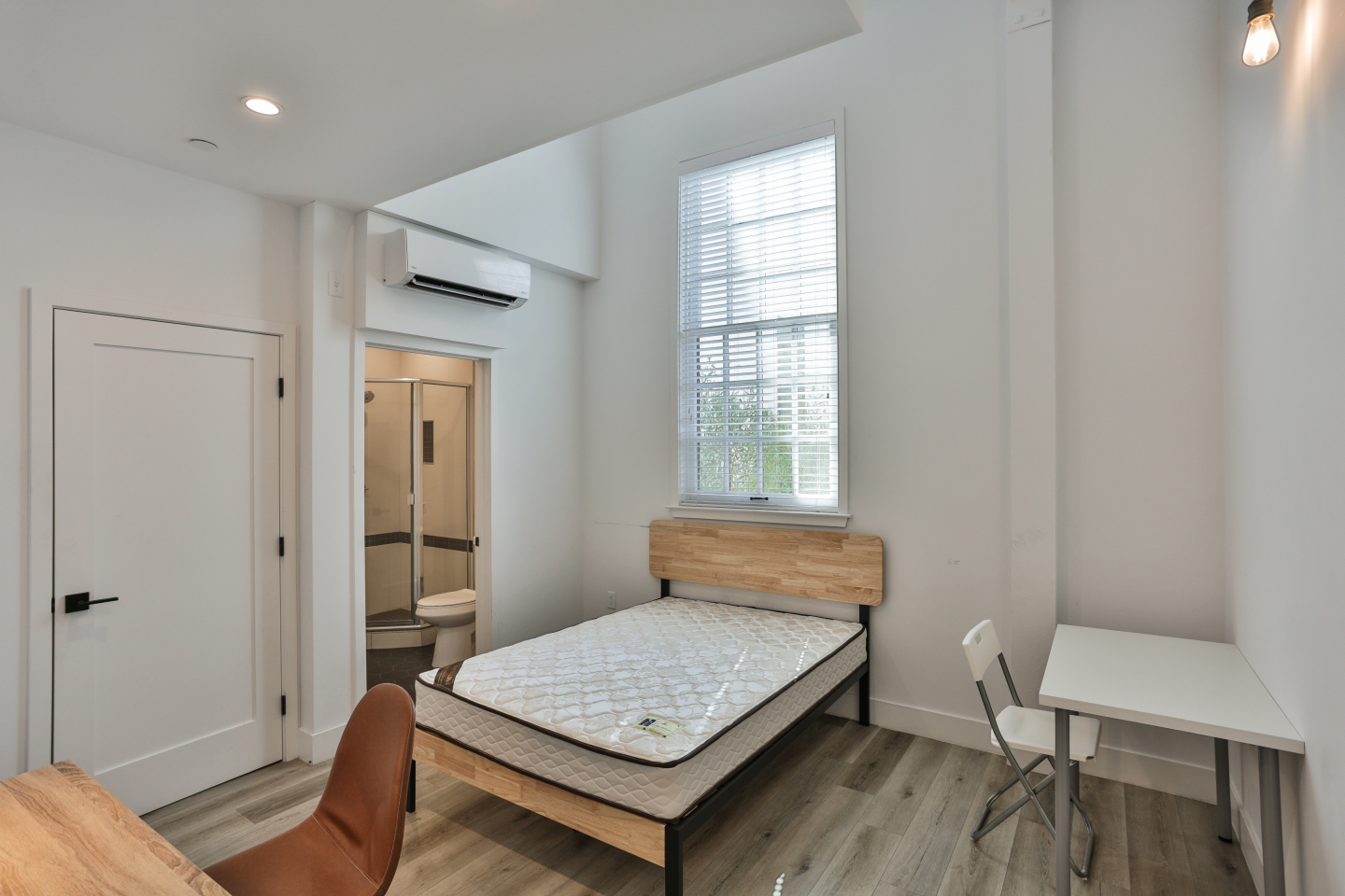 white mattress, clean room, wood bed frame 