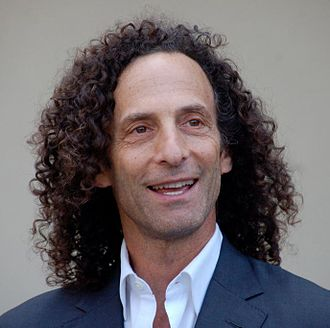 Kenny G in a blue blazer and white shirt.