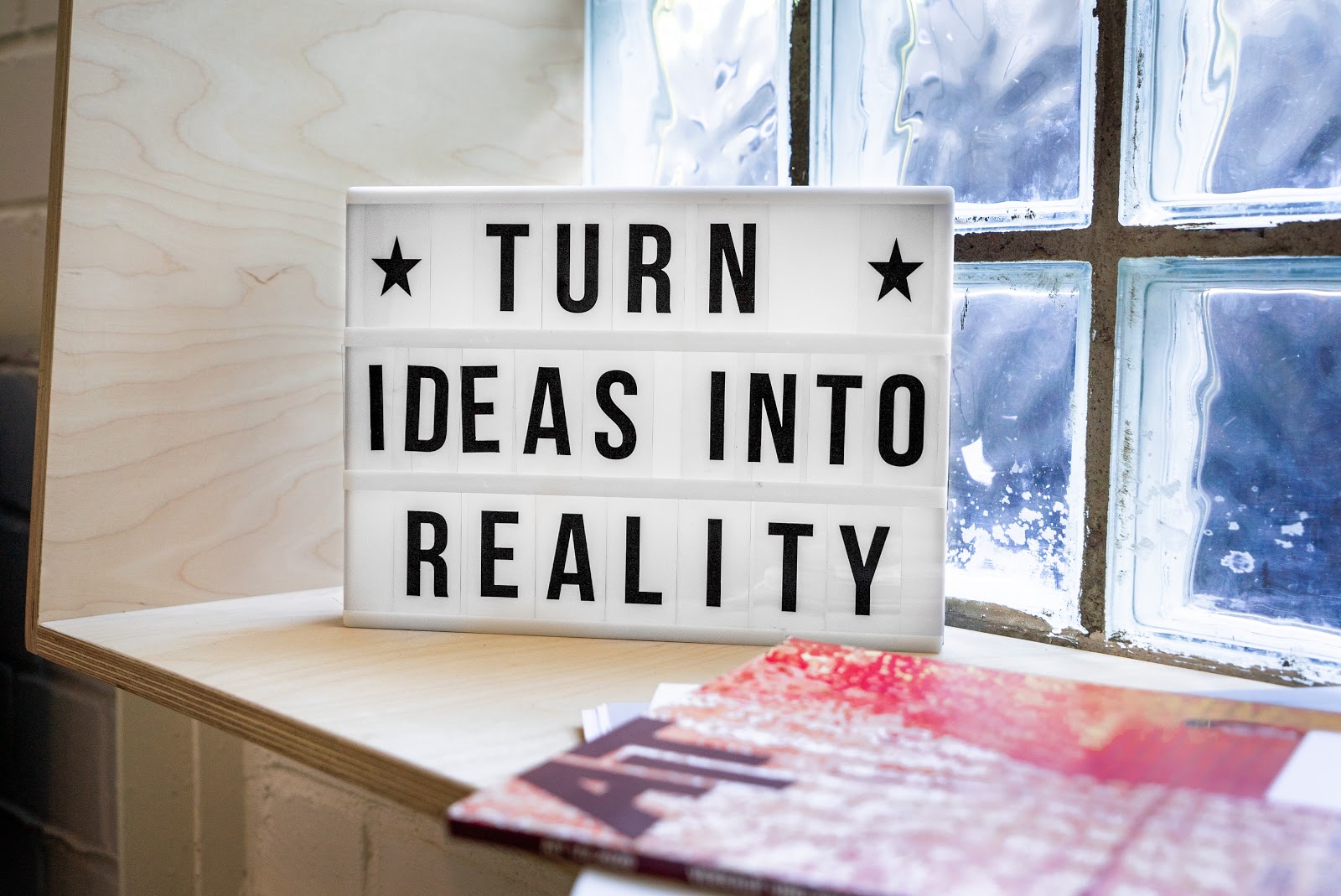 sign that reads turn ideas into reality 