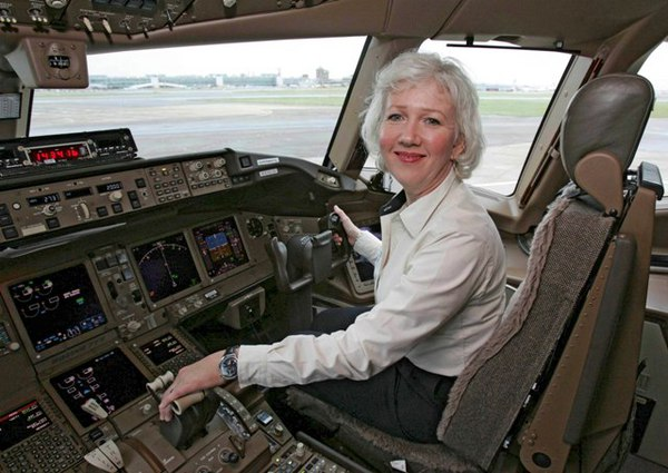 Suzanna Darcy-Henneman in the cockpit of an airplane.