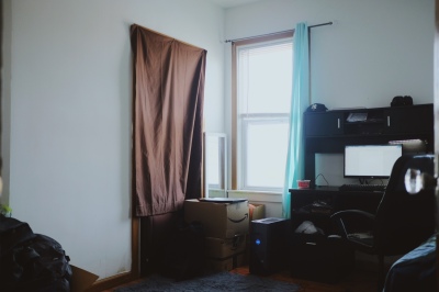 brown sheet covering doorway, bedroom 